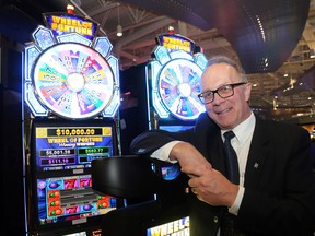 Intelligencer file photo
Andy LaCroix, executive director of stakeholder relations in Ontario with Great with Canadian Gaming Corporation leans against some of the machines during the opening celebration of Shorelines Casino.