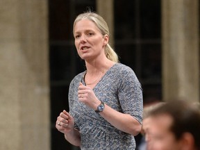 Minister of Environment and Climate Change Catherine McKenna rises during Question Period in the House of Commons on Parliament Hill, in Ottawa on Friday, March 24, 2017. (THE CANADIAN PRESS/Justin Tang)