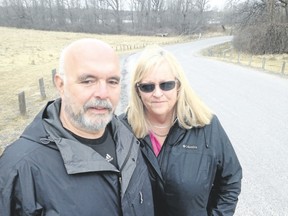 Wayne Martin and Maureen Blackler are concerned about a plan to install traffic-calming measures — possibly speed humps — on the road leading into Lemoine Point Conservation Area.(Elliot Ferguson/The Whig-Standard/Postmedia Network)