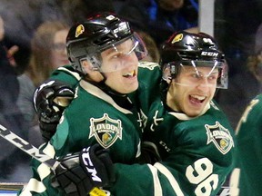 Robert Thomas of the Knights celebrates his first goal of the series with linemate Dante Salituro and the first goal of the game as he picked up a rebound and had an empty net with Michael DePietro out of position during the first period of their playoff game Friday March 31, 2017 at Budweiser Gardens. (MIKE HENSEN, The London Free Press)