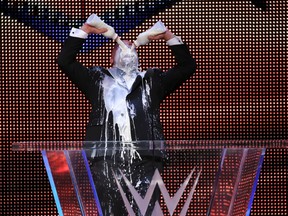Olympic gold medallist and World Wrestling Entertainment Hall of Fame inductee Kurt Angle swills some of his trademark milk after delivering his acceptance speech at the Amway Center in Orlando, Fla., on Friday night. (Ricky Havlik/SLAM! Wrestling)
