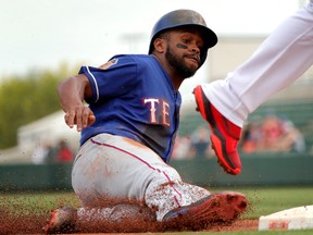 Delino DeShields Jr., steals third against the Angels in a Cactus League game earlier in March. (Matt York, AP)