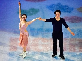 Tessa Virtue and Scott Moir of Canada stand on the ice after performing their routine of the Ice Dance / Free Dance event at the ISU World Figure Skating Championships in Helsinki, Finland on April 1, 2017. (JOHN MACDOUGALL/AFP/Getty Images)