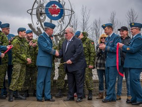 8 Wing Commander Colin Keiver along with Mayor of Quinte West, Jim Harrison, Wing Chief Warrant Officer Darcy Elder and members from 8 Air Maintenance Support Squadron (ATESS), officially unveil the "Globe of Unity" at the roundabout of RCAF and Hamilton Road on April 01, 2017 in Trenton Ontario. Photo by Master Corporal Mathieu St-Amour, 8 Wing Imaging