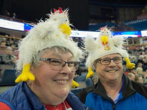 Dee and Grant Hopley of Nipiwin Saskatchewan. Hardcore curling fans watch the first day of curling at the Mens's World Curling Championships at Northlands Coliseum on April 1, 2017. Photo by Shaughn Butts / Postmedia