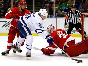 Zach Hyman of the Maple Leafs tires to get a shot past Jimmy Howard and Mike Green of the Red Wings at Joe Louis Arena on April 1, 2017 in Detroit. (Gregory Shamus/Getty Images)