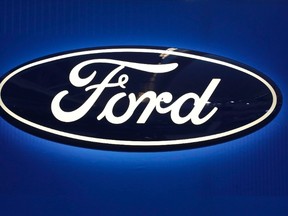 This Feb. 11, 2016, file photo shows the Ford logo on display at the Pittsburgh International Auto Show in Pittsburgh. Ford is recalling 53,000 2017 F-250 trucks because they can roll away even when they are parked due to a manufacturing error. (THE CANADIAN PRESS/AP/Gene J. Puskar, File)