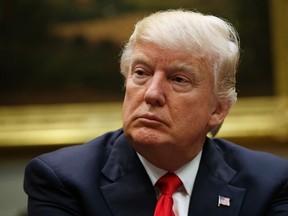 In this March 31, 2017, photo, U.S. President Donald Trump listens during a meeting with the National Association of Manufacturers in the Roosevelt Room of the White House in Washington. (AP Photo/Evan Vucci)