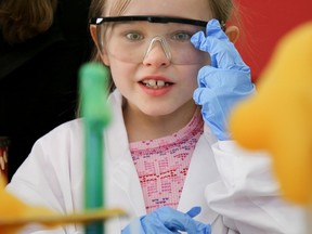 Seven-year-old Charlotte helps with an experiment put on by Loyalist students during the Quinte Regional Science and Technology Fair at Loyalist College on Saturday April 1, 2017 in Belleville, Ont. Tim Miller/Belleville Intelligencer/Postmedia Network