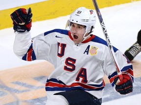 United States forward Colin White celebrates his goal against Canada at the World Junior Championship Thursday, January 5, 2017 in Montreal. (THE CANADIAN PRESS/Paul Chiasson)