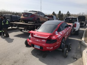 Twelve luxury cars have been impounded and their drivers charged with stunt driving after police say they put on a dangerous display on Ontario’s Highway 400 on Sunday. (OPP_HSD/Twitter)