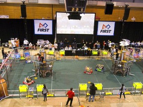 The floor of the FIRST robotics competition at Thompson recreation centre at Western University features two towers for the blue and red teams. (MIKE HENSEN, The London Free Press)