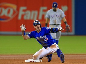 Josh Donaldson of the Blue Jays reacts after hitting a double against the Texas Rangers during Game 3 of the American League Division Series at Rogers Centre on October 9, 2016 in Toronto. (Vaughn Ridley/Getty Images)