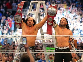 Matt, left, and Jeff Hardy celebrate with the Raw tag-team championship belts inside the ring following their ladder match victory on Sunday at WrestleMania 33 at Camping World Stadium in Orlando. The due made a surprise return for the match. (Ricky Havlik/SLAM! Wrestling)