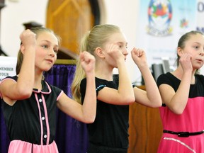 During the Junior Contemporary Group class of the 71st Optimist Club of Mitchell Music Festival last Friday afternoon at the Knox Presbyterian Church, eventual winners Cydney Weir (left), Shawni DeJong and Lauren McKay perform, complete with crying at the suitable parts, to Lesley Gore’s It’s My Party. ANDY BADER/MITCHELL ADVOCATE