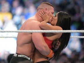 WWE Superstars John Cena, left, and Nikki Bella kiss after she accepted his marriage proposal during WrestleMania 33 on Sunday, April 2, 2017, in Orlando, Fla. (Phelan M. Ebenhack/AP Images for WWE)