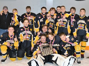 Members of the Mitchell Bantam LL team celebrate their co-championship with South Bruce in the WOAA White division. Back row (left): Rob Steinbach (manager), Ken Monden (trainer), Kurtis DeJong, Kole Hunt, Brent Smith, Curtis Chaffe, Jaden Faulkner, Josh Bedour, Denzyl Finlayson, Wade Monden, Jack Chaffe (coach). Front row (left): Dominic Voros, Carter Yost, Cole Wilton, Stevie Daum, Will Steinbach, Basil Voros. SUBMITTED