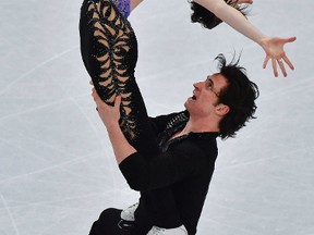 Canada's Tessa Virtue and Scott Moir compete in the ice dance/short dance event at the ISU World Figure Skating Championships in Helsinki, Finland on March 31, 2017. (AFP PHOTO / John MACDOUGALL)