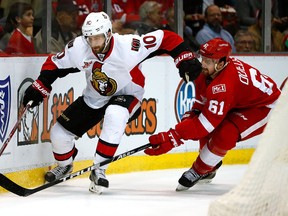 Tom Pyatt of the Senators tries to get around the stick of Xavier Ouellet of the Detroit Red Wings at Joe Louis Arena on April 3, 2017 in Detroit. (Gregory Shamus/Getty Images)