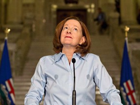 Former Alberta Premier Alison Redford announces her resignation in Edmonton on Wednesday March 19, 2014.