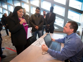 Preet Toor records her name for City of Edmonton employe Robert Gagnon who is recording her name for a voter-assist device to be used on election day. 32 people filed papers on nomination day or a by-election in Ward 12, taken on January 25, 2016.