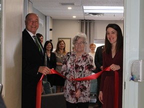 A number of people were on hand to celebrate the opening of the hospice room at the Lady Minto Hospital. Cutting the ribbon was Pat Dorff, Hospital Chair, Paul Chatelain, CEO of the hospital and Melanie Ciccone, Outreach officer for NE LINN.