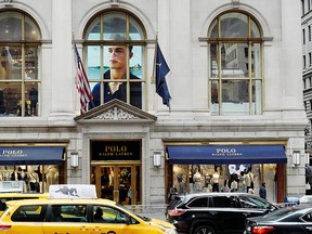 Traffic passes the Polo Ralph Lauren store on Fifth Ave., Tuesday, April 4, 2017, in New York. (AP Photo/Mark Lennihan)
