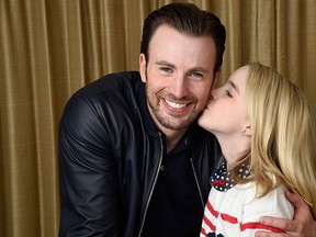In this March 23, 2017 photo, Chris Evans, left, and Mckenna Grace, cast members in the film "Gifted," pose for a portrait at the Four Seasons Hotel in Los Angeles. (Photo by Chris Pizzello/Invision/AP)
