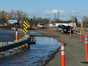 Rising water forces a lane closure on Highway 3 near the community of Brunkild, Man., on Mon., April 3, 2017. Kevin King/Winnipeg Sun