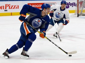 Edmonton Oilers captain Connor McDavid, left, and David Desharnais take part in a team practice at Rogers Place, in Edmonton on Monday April 3, 2017. (David Bloom)