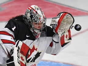 Team Canada goaltender Shannon Szabados makes a glove save during Women's World Hockey Championship action against the United States, in Plymouth, Mich., on March 31, 2017. (THE CANADIAN PRESS/Jason Kryk)