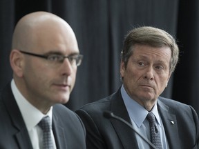 Ontario Minister of Transportation Steven Del Duca (left) joins Toronto Mayor John Tory during a news conference on Tuesday, April 4, 2017, at Pearson airport to announce plans for a Toronto Pearson Regional Transit Centre. (STAN BEHAL/TORONTO SUN)