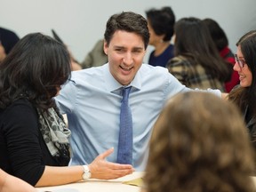 Prime Minister Justin Trudeau visits caregivers and their family members at Malvern Family Resource Centre in Toronto on Friday March 31, 2017. (THE CANADIAN PRESS/Frank Gunn)