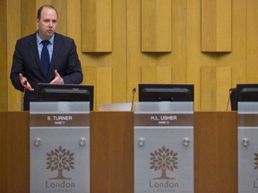 Stephen Turner councillor Ward 11 had lots of space when council debated BRT on Tuesday April 4, 2017. Mike Hensen/The London Free Press/Postmedia Network