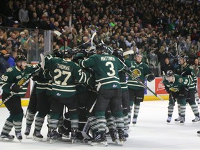 The Knights mob Tyler Parsons after winning game 7 over the Windsor Spitfires on Tuesday April 4, 2017. Mike Hensen/The London Free Press/Postmedia Network