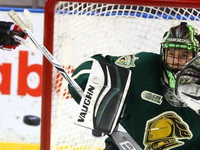London Knights goalie Tyler Parsons gets ready to block a high shot during the first period of Game 7 against the Windsor Spitfires at Budweiser Garden on Tuesday night.  (Mike Hensen/The London Free Press)
