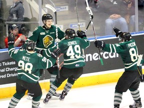 Olli Juolevi is mobbed by teammates Victor Mete, Max Jones and JJ Piccinich after putting the Knights ahead 3-2 in the third period of Game 7 of their OHL Western Conference quarterfinal against the Windsor Spitfires at Budweiser Gardens on Tuesday night. The goal sttod as the game and series winner.  (MIKE HENSEN, The London Free Press)