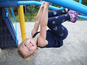 Three-year-old Serenity Lefrancois plays on the structure at Jeanne d'Arc playground in Dominion Park. (Gino Donato/Sudbury Star file photo)