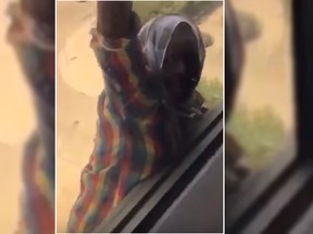 Screen grab from a video of a maid falling from a 7-storey window.