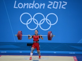 Canada's Christine Girard competes on her way to winning bronze during the Women's 63kg Weightlifting final on Day 4 of the London 2012 Olympic Games at ExCeL on July 31, 2012 in London, England.  (Laurence Griffiths/Getty Images)