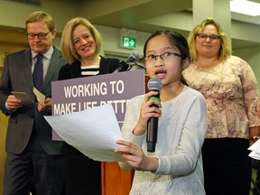 Eunique Situmorang (front, 10-years-old) thanks Alberta Education Minister David Eggen (left), Alberta Premier Rachel Notley (middle) and Alberta Health Minister Sarah Hoffman (right) at Our Lady of Peace School in Edmonton on Wednesday April 4, 2017