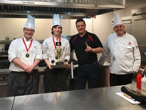 Viking students Owen Card and Jordan Vanderhelm celebrate a recent victory at a Fanshawe college skills competition, standing with Chef Scott Newman and a representative of Fanshawe College hospitality program. (Contributed)