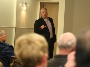 Jason Miller/The Intelligencer
Coun. Paul Carr address residents in Thurlow during a meeting there Tuesday. Carr told residents the city continues to fight to have Veridian acquire the Hydro One service area.