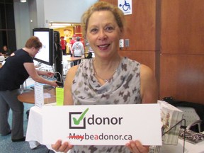 Sarnia's Michelle Weber was volunteering Wednesday at a Be A Donor Month information booth in the atrium at Bluewater Health. The donated organs of Weber's 15-year-old son saved the lives of six terminally-ill patients. (Paul Morden/Sarnia Observer/Postmedia Network)
