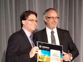 Chatham-Kent Mayor Randy Hope, right, received the 'Friend of Wind Award' from Canadian Wind Association president Robert Hornung during a ceremony on Tuesday, April 4, 2017 in Gatineau, QC. (Handout/Chatham Daily News)