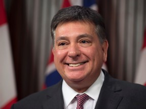 Ontario Finance Minister Charles Sousa smiles as he discusses the Federal Buget at a news conference in Toronto on Monday, March 22, 2017. (THE CANADIAN PRESS/Frank Gunn)