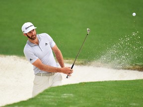 Dustin Johnson of the United States plays a shot from a bunker on the tenth hole during a practice round prior to the start of the Masters Tournament at Augusta National Golf Club on April 5, 2017. (Harry How/Getty Images)