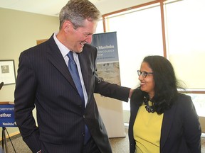 Premier Brian Pallister chats with Cancer Care Manitoba CEO Dr. Sri Navaratnam after announcing additional funding for cancer drugs during a press conference in Winnipeg, Man. Monday June 06, 2016. Winnipeg Sun files