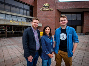 Gatineau councillor Cedric Tessier (L), coordinator of youth commission Josiane Cossette (C) and youth commission member Pierre-Olivier Bouchard (R) pose for a photo in front of Gatineau City Hall. Photo by Chris Donovan CHRIS DONOVAN / OTTAWA CITIZEN