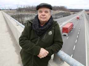 Williamsville Coun. Jim Neill, standing on the Montreal Street overpass in Kingston on Wednesday, says the provincial government should tighten the rules about transporting hazardous materials along Highway 401 during severe winter weather. (Elliot Ferguson/The Whig-Standard)